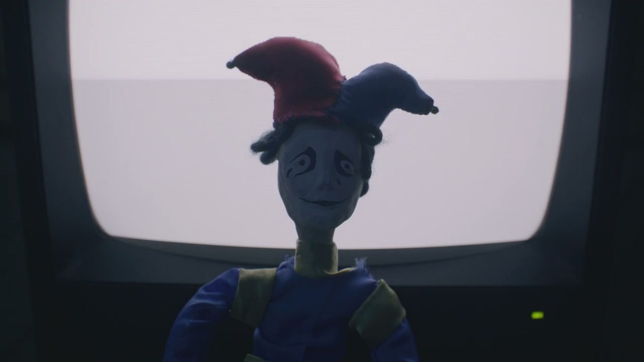 Creepy Jester Doll Revealed by TV Light