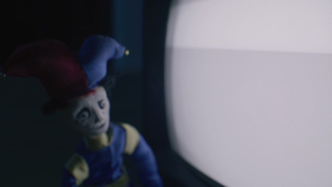 Creepy Jester Doll Next to Static TV