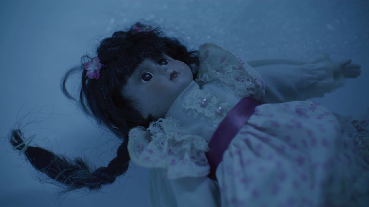 Eerie Porcelain Doll in Water