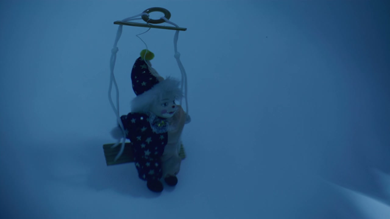 Vintage Clown Doll Swinging on Miniature Swing