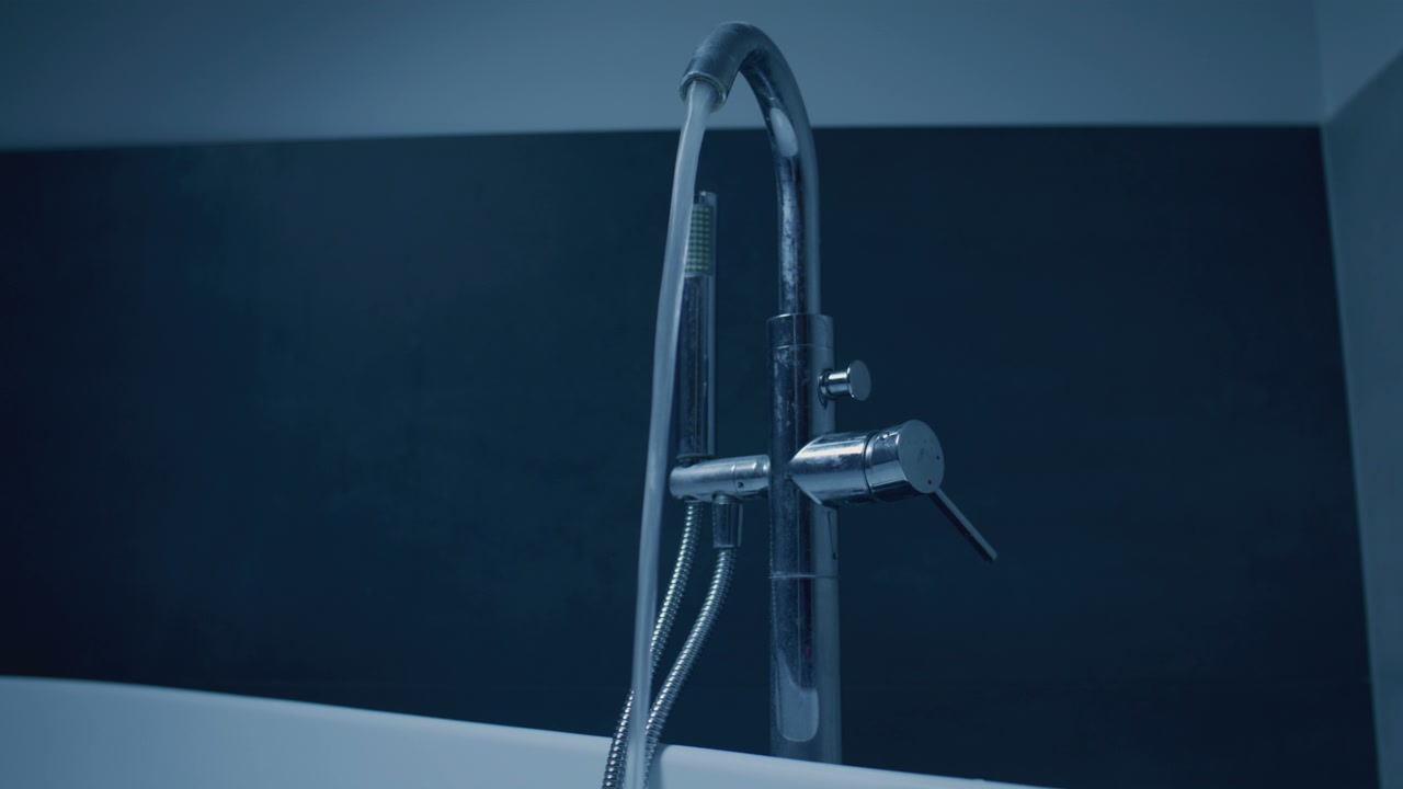 Water Running from Faucet into Bathtub