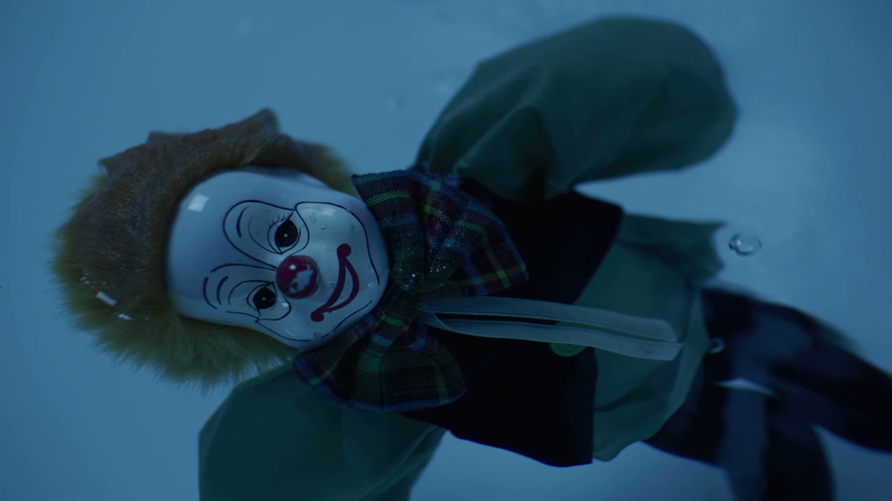 Creepy Clown Doll Floating in Water