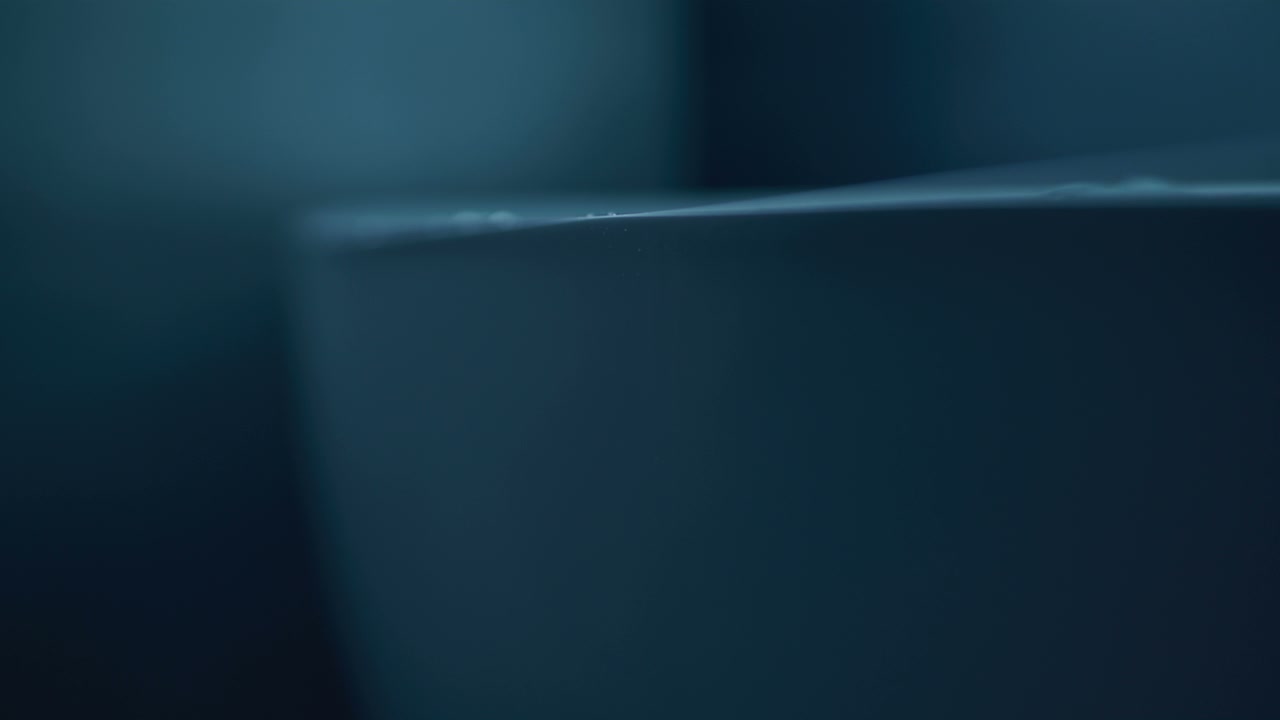 Water Droplets Falling on Dark Surface