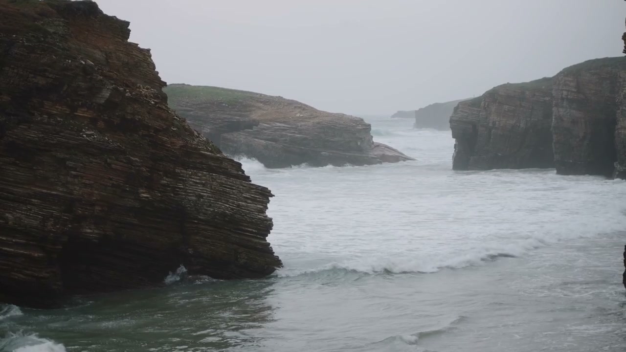 Ocean Waves Against Coastal Cliffs