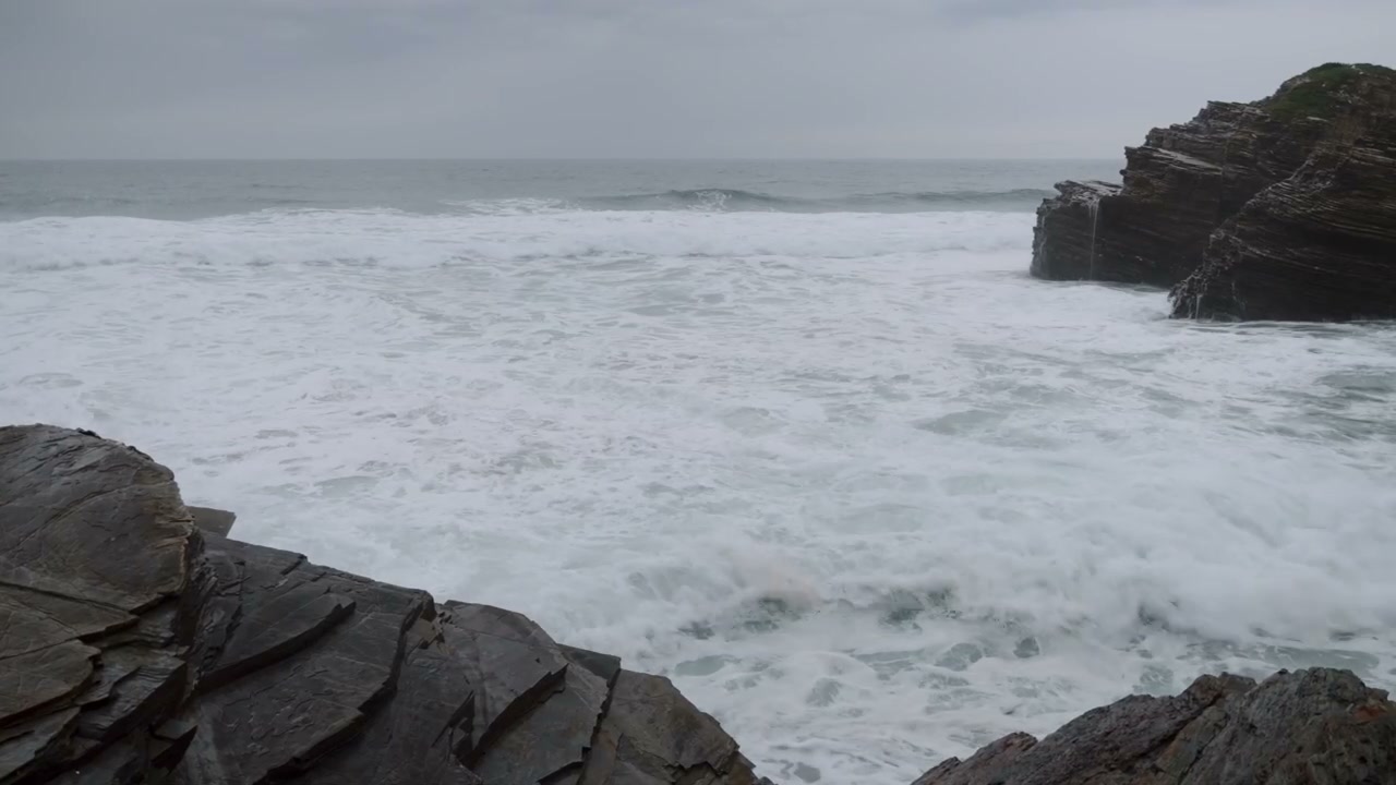 Ocean Waves Crashing on Rocky Shore