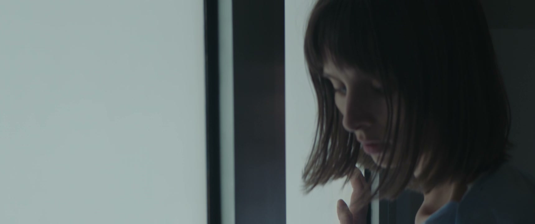 Pensive Woman by Hospital Window