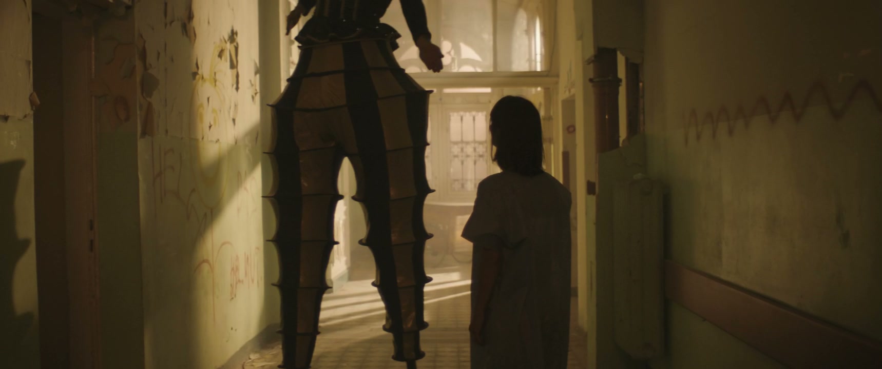 Patient Follows Stilt Walker in Eerie Hospital