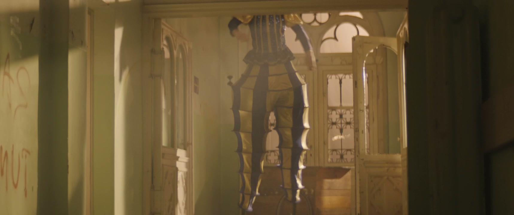 Tall Jester in Eerie, Abandoned Building