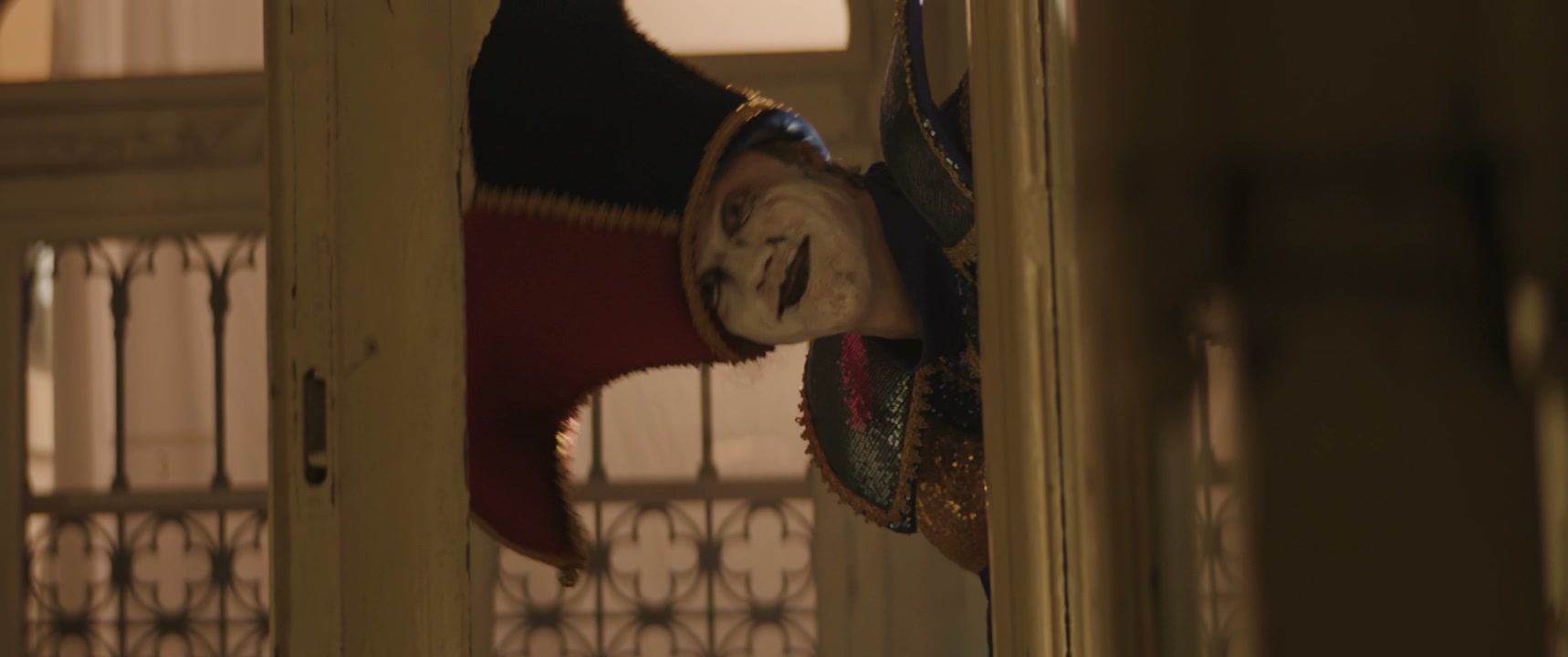 Creepy Jester Peeks Around Corner