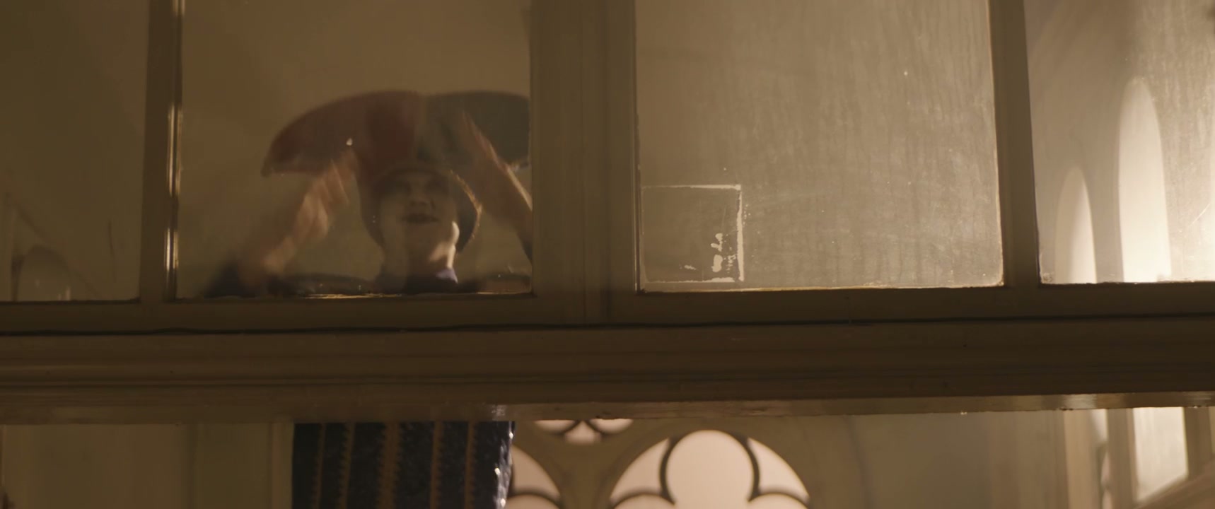 Eerie Jester Peeking and Falling from Window