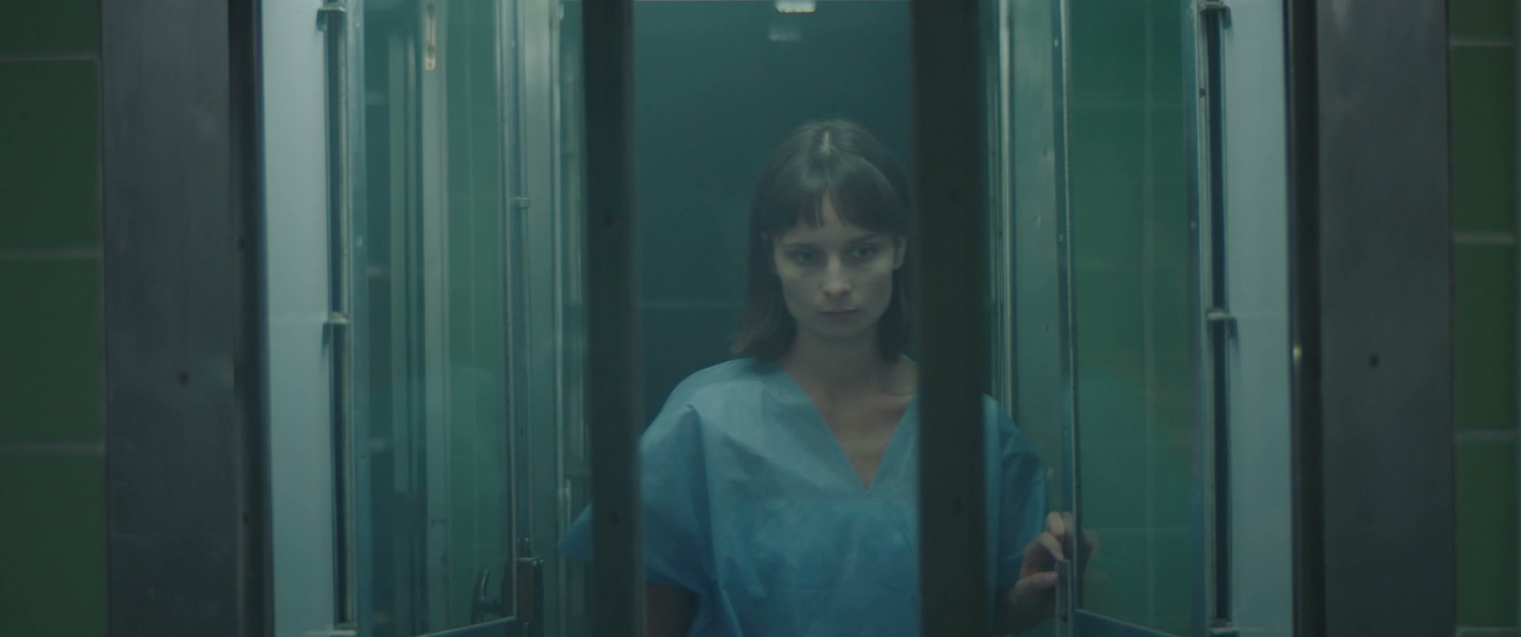 Anxious Woman in Hospital Corridor