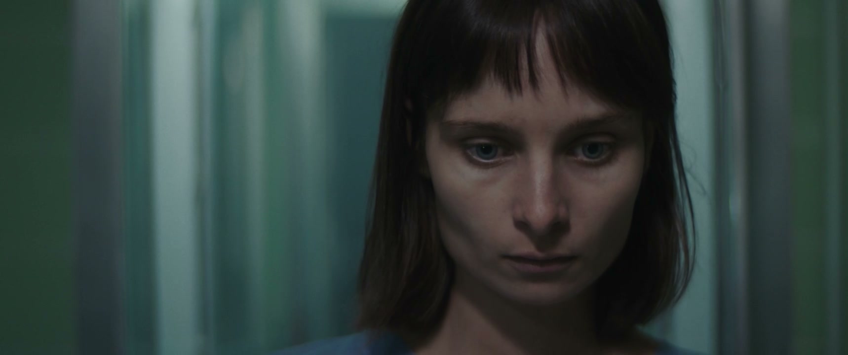 Pensive Woman in Hospital Ward