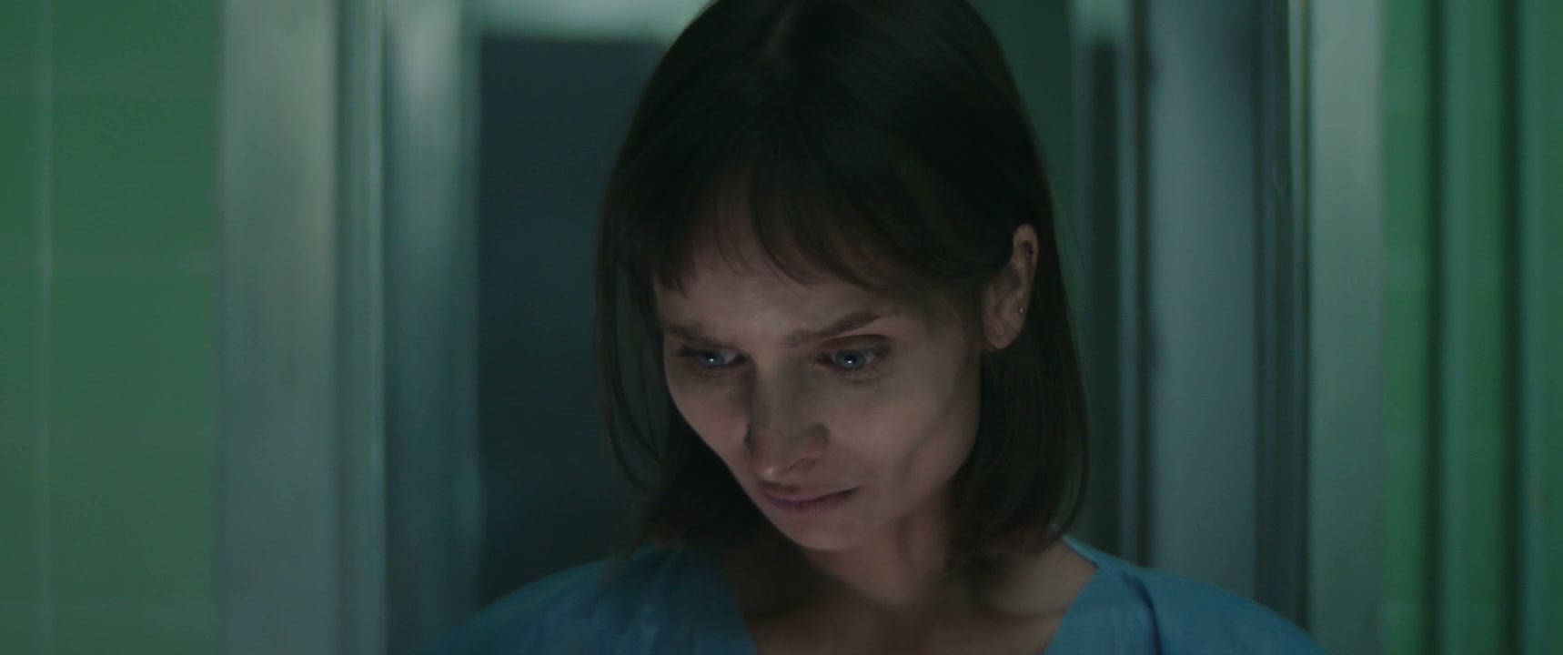 Scared Woman in Hospital Corridor