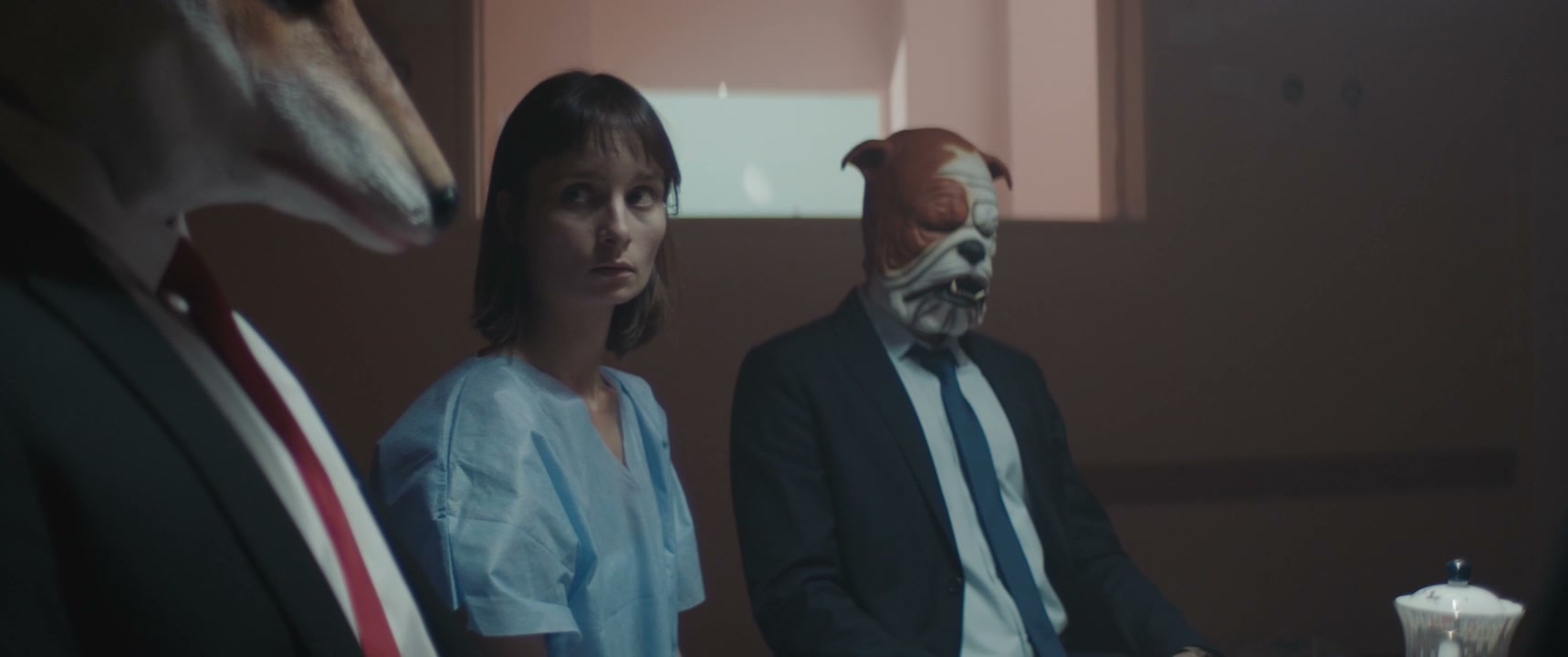 Woman in Hospital Gown with Animal Masked Figures