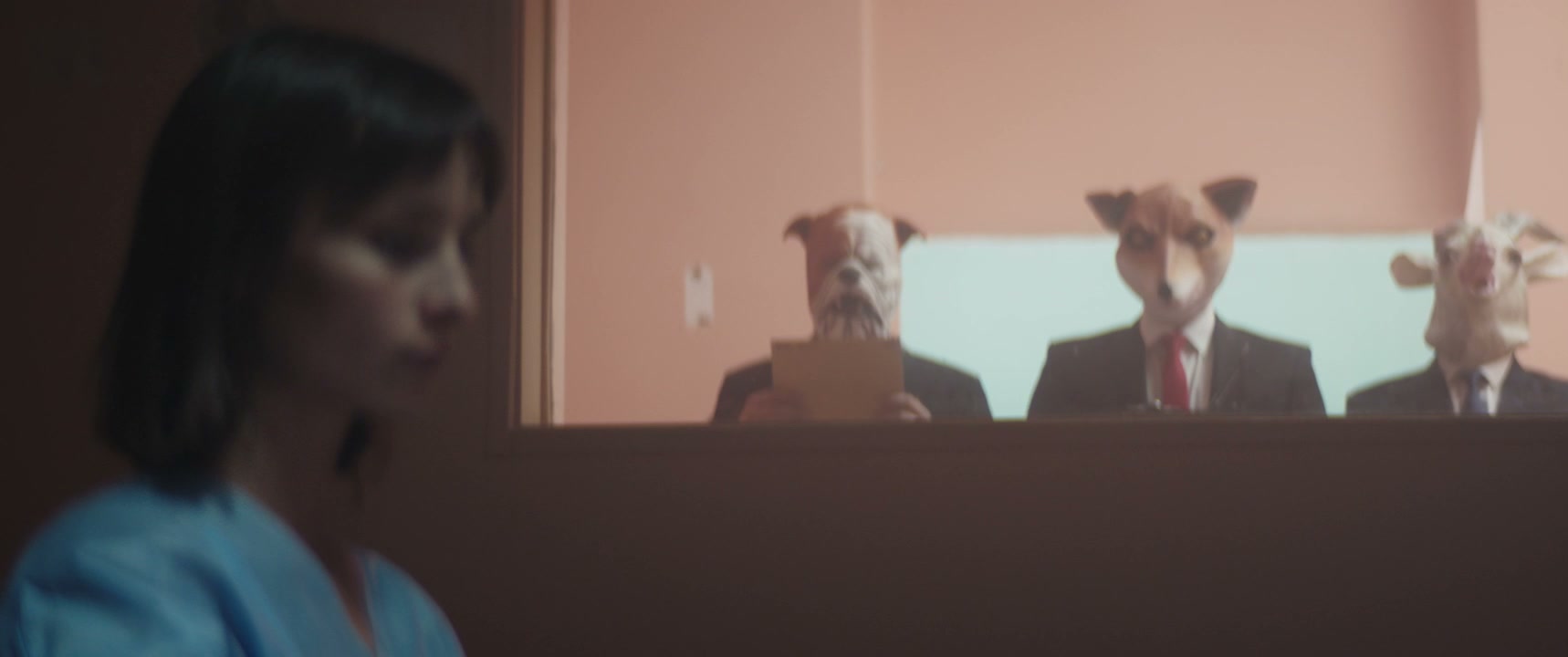 Woman in Hospital Interrogation Room with Masked Men