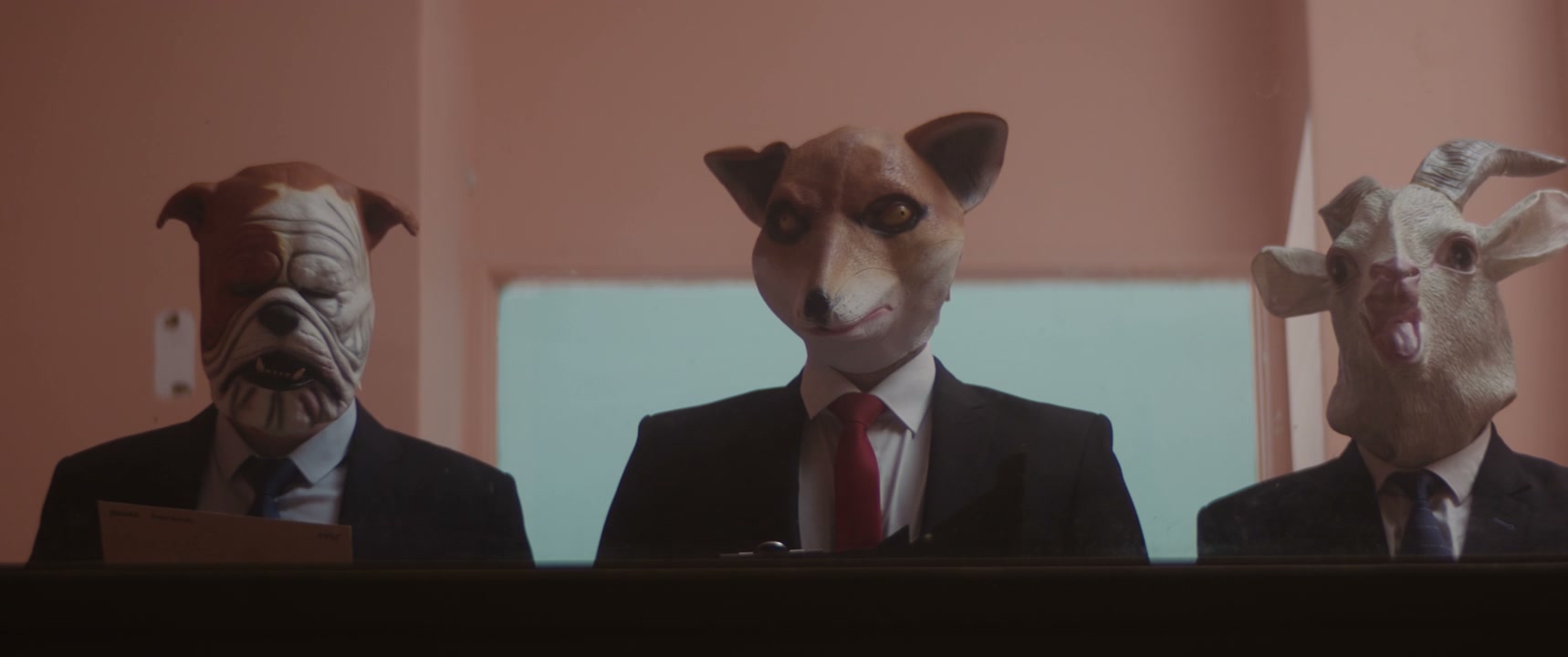 Business People in Animal Masks Sitting Down