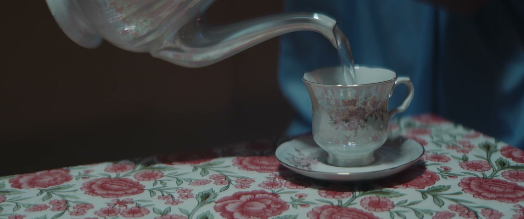 Pouring Hot Water into a Floral Teacup
