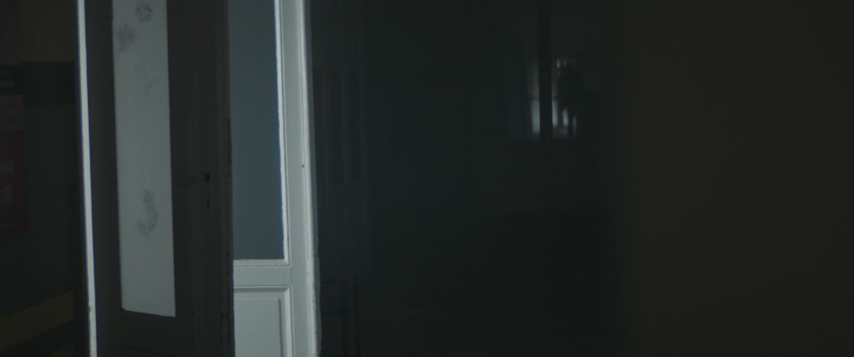 Woman Fleeing Dark Hospital Hallway
