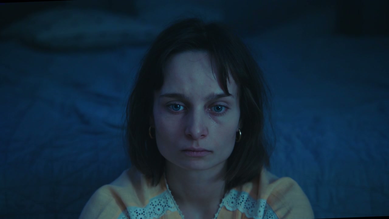 Young Woman With Sad Tired Eyes at Night