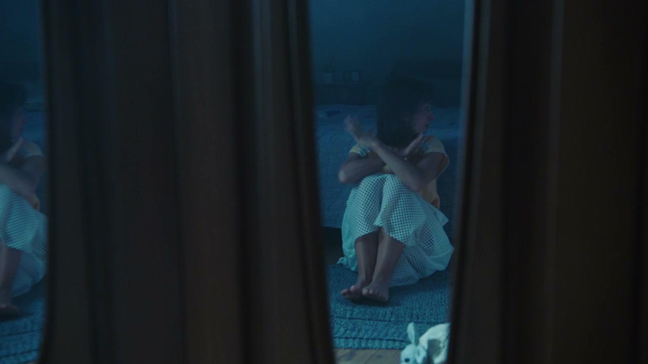 Upset Young Woman Sitting on Floor