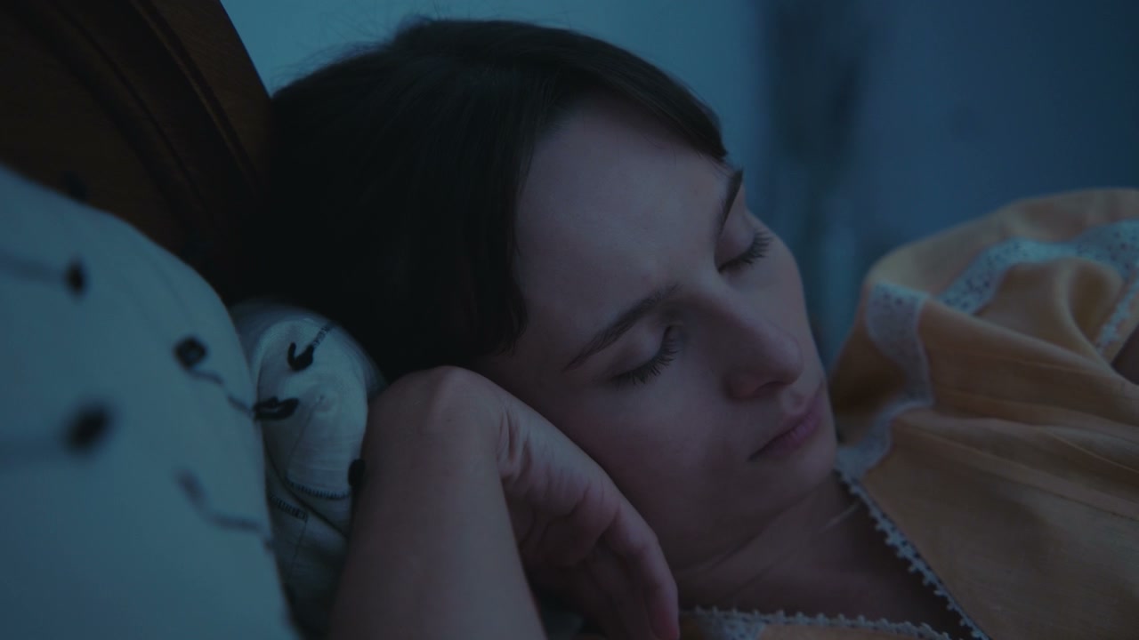 Pensive Woman Waking Up in Bed