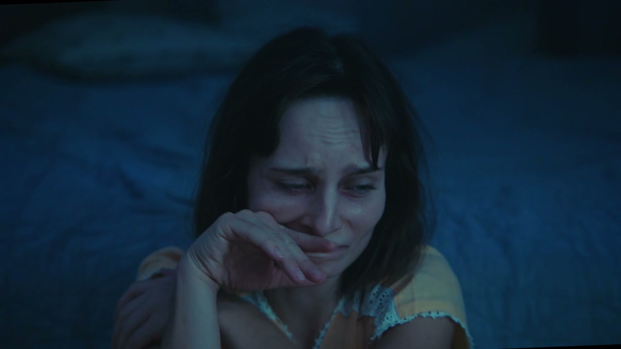 Scared Woman Crying in Dark Bedroom