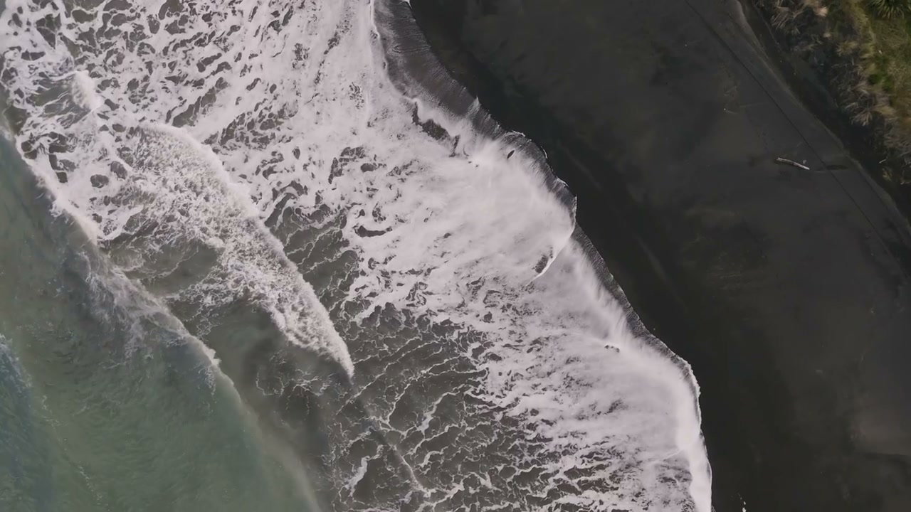 Ocean Waves Crashing on Black Sand Beach, New Zealand