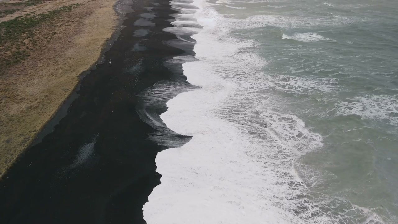 New Zealand Black Sand Beach and Crashing Waves