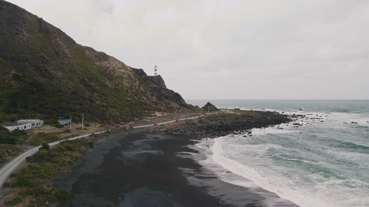 New Zealand Coastline with Lighthouse and Black Beach