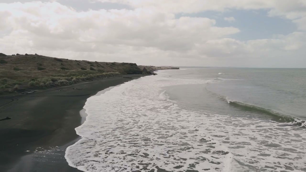New Zealand Black Sand Beach and Ocean Waves