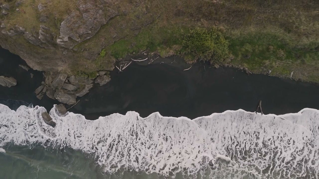 Aerial Waves on New Zealand Black Sand Beach