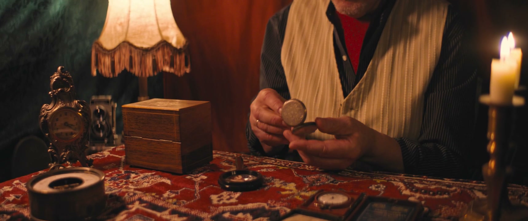 Man Examining Vintage Pocket Watch