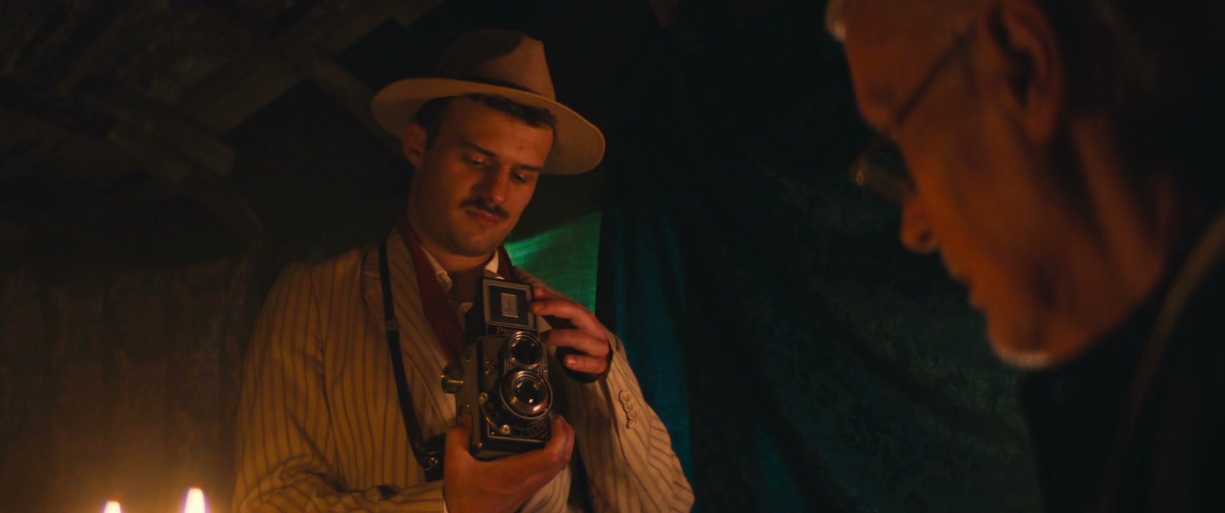 Photographer Showing Vintage Camera