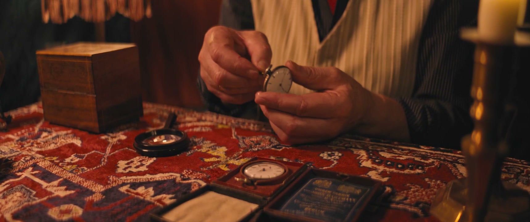 Hands Inspecting Vintage Pocket Watch