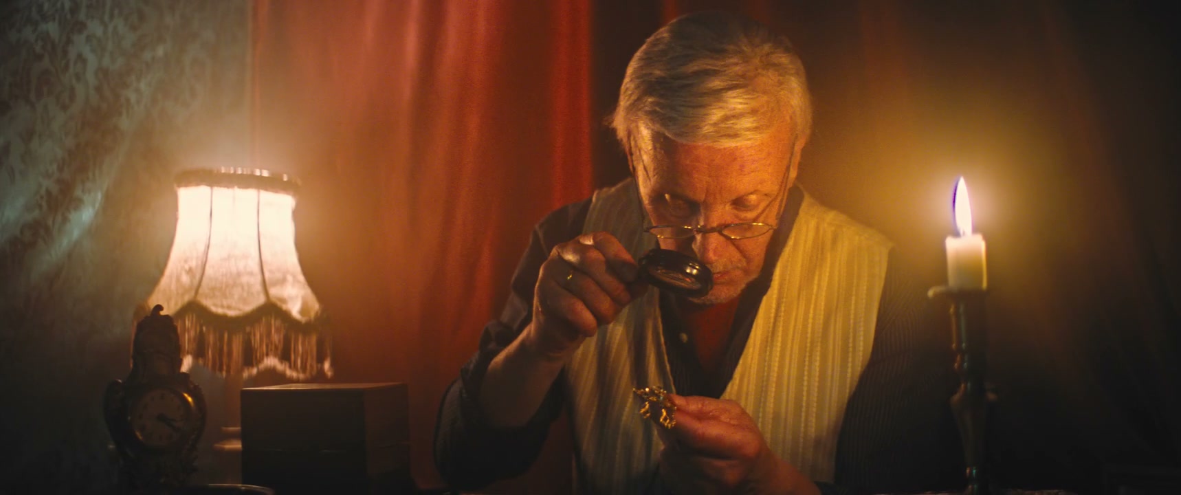 Senior Man Examining Vintage Watch with Magnifier