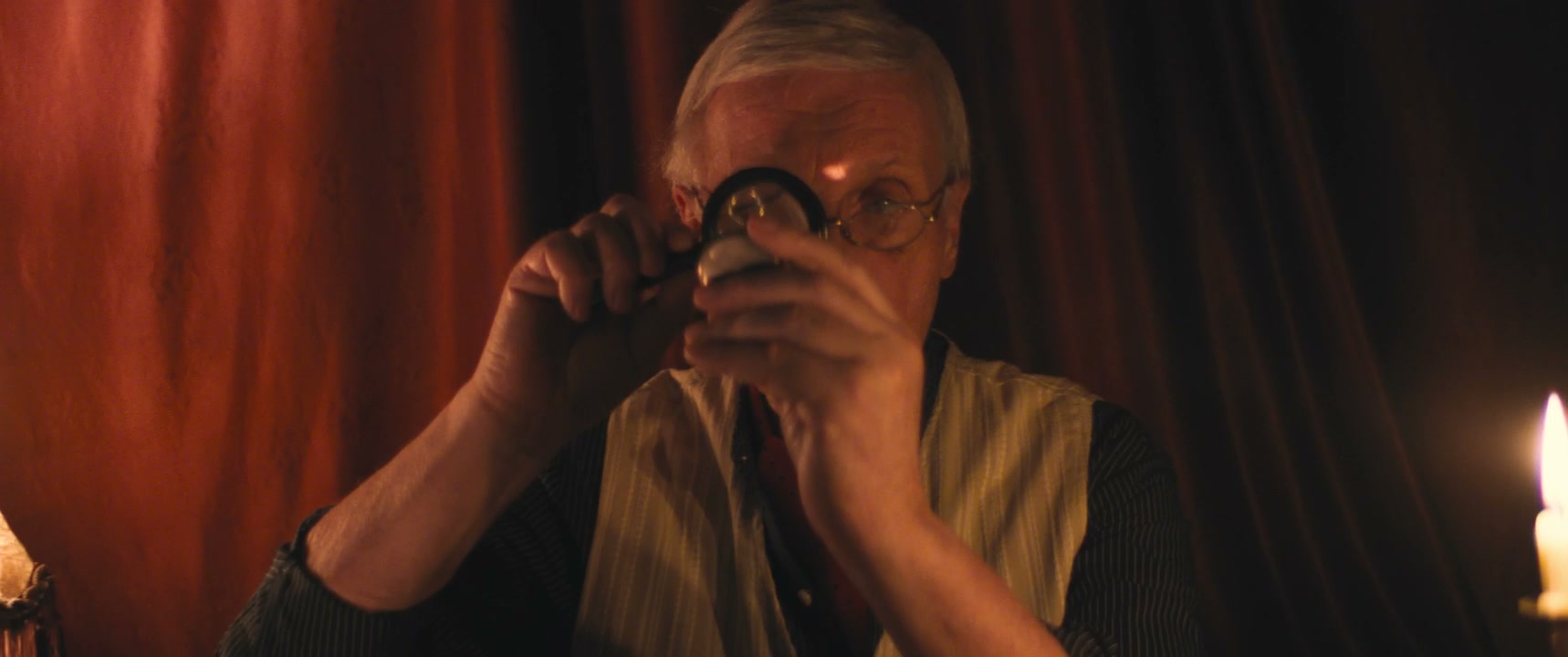 Vintage Man Examining Watch with Magnifying Glass