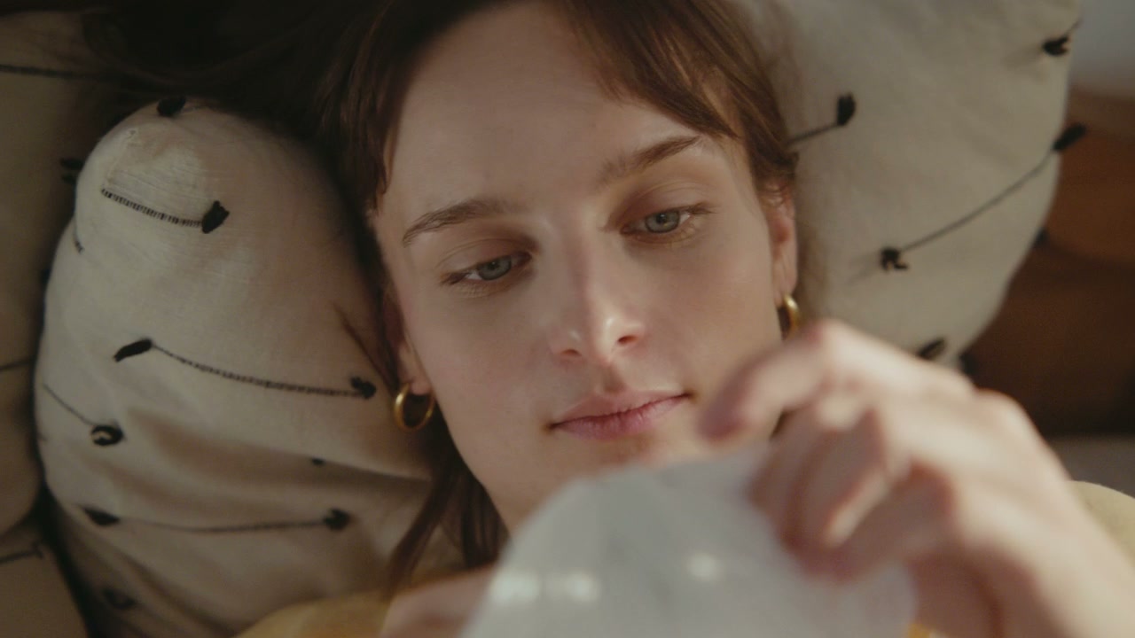 Woman Examining Delicate Object
