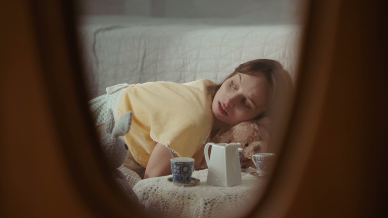 Woman Playing Tea Party Reflected in Mirror