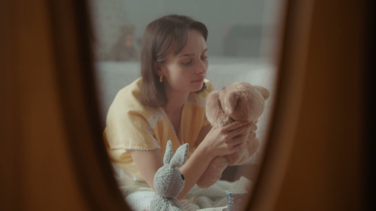 Woman Playing with Teddy Bear