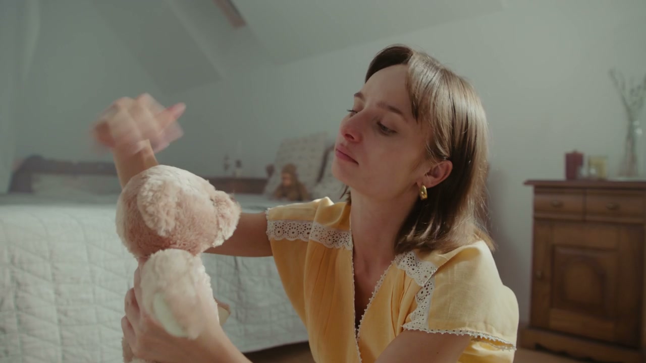 Pensive Woman with Teddy Bear