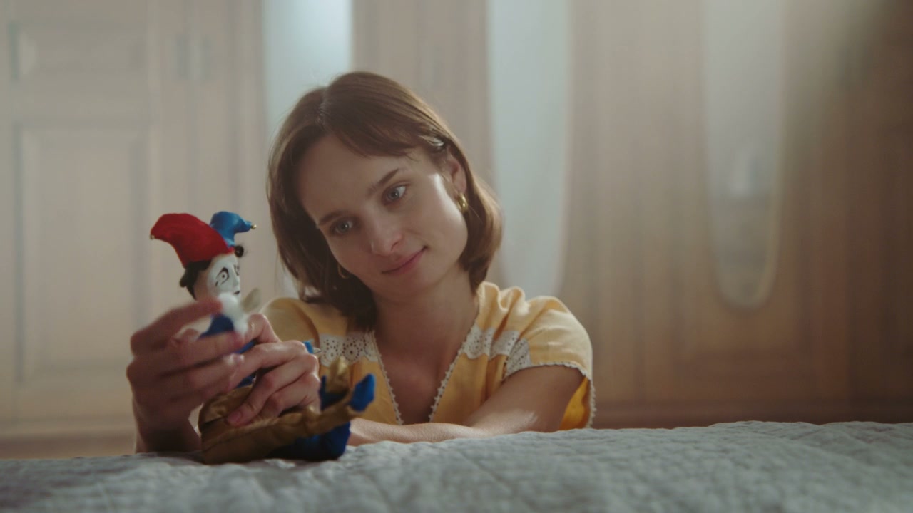 Playful Woman With Jester Doll