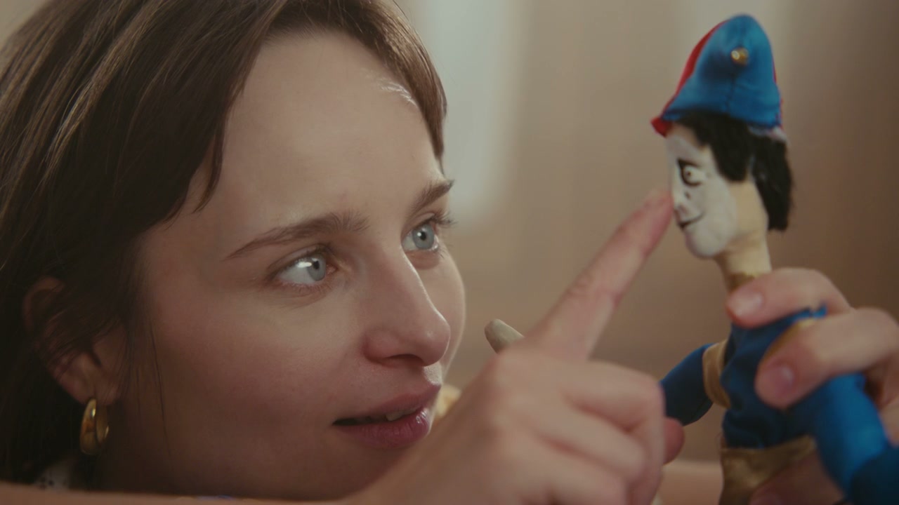 Woman Interacting With A Puppet