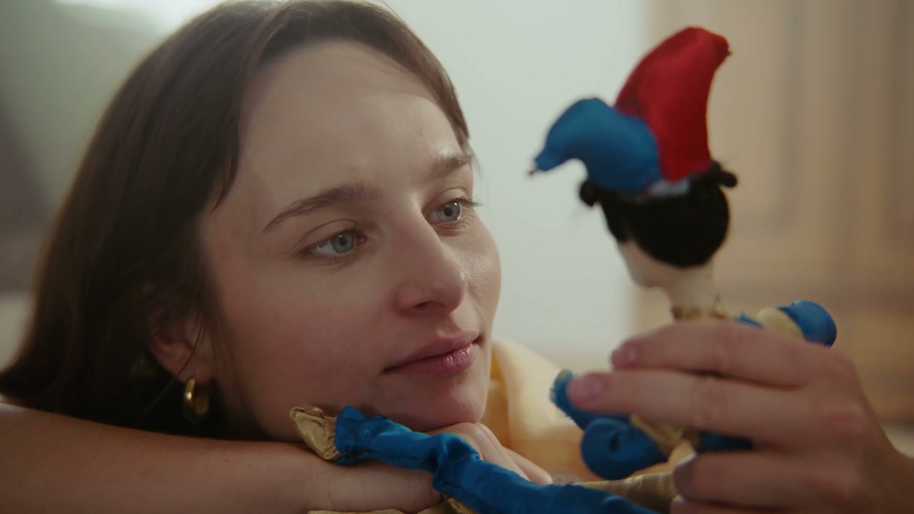 Woman Playing With Jester Doll