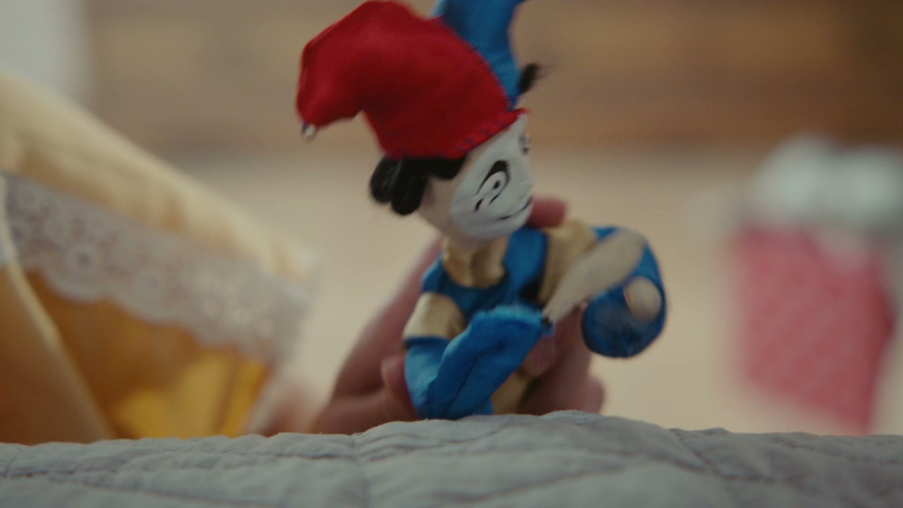 Hand Playing with Jester Puppet Doll