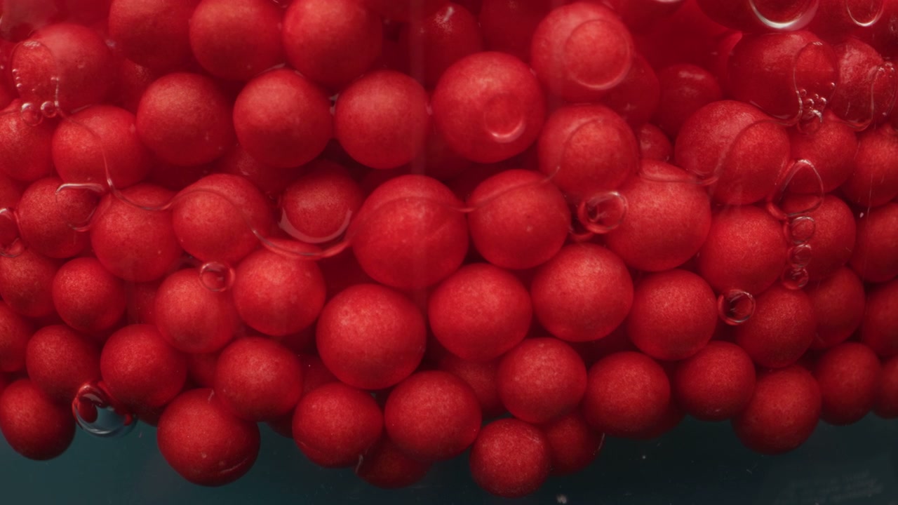 Red Spheres in Liquid with Bubbles