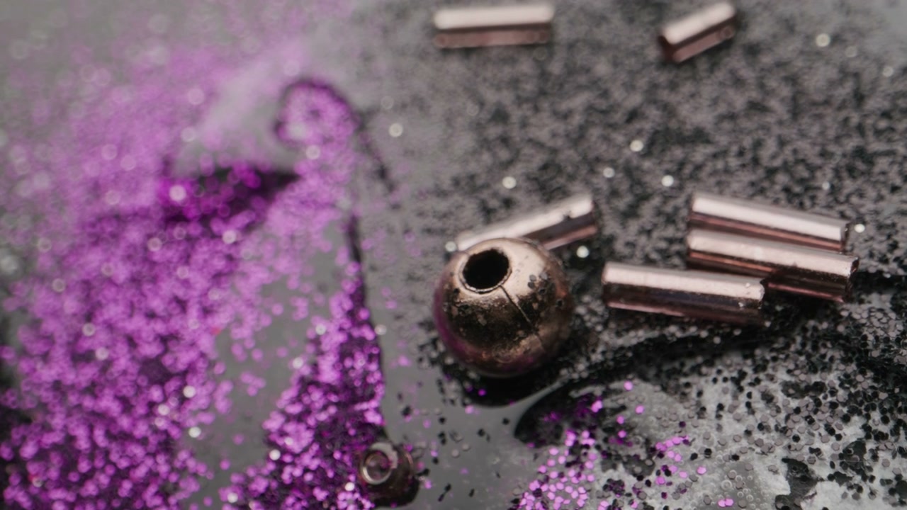 Glitter Beads on Abstract Shimmering Surface