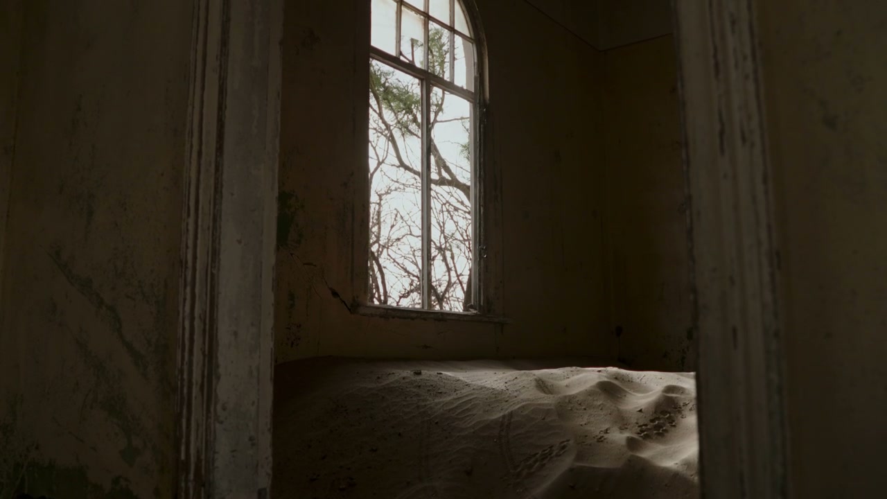 Window in Sand-Filled Desert Ghost Town