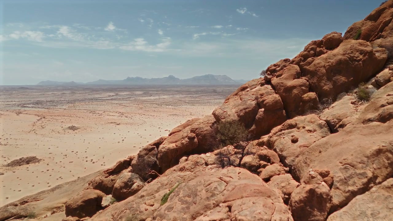 Vast Desert Landscape and Granite Boulders