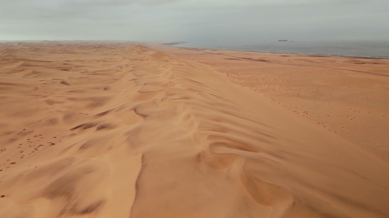 Vast Desert Dunes Along Ocean Coast