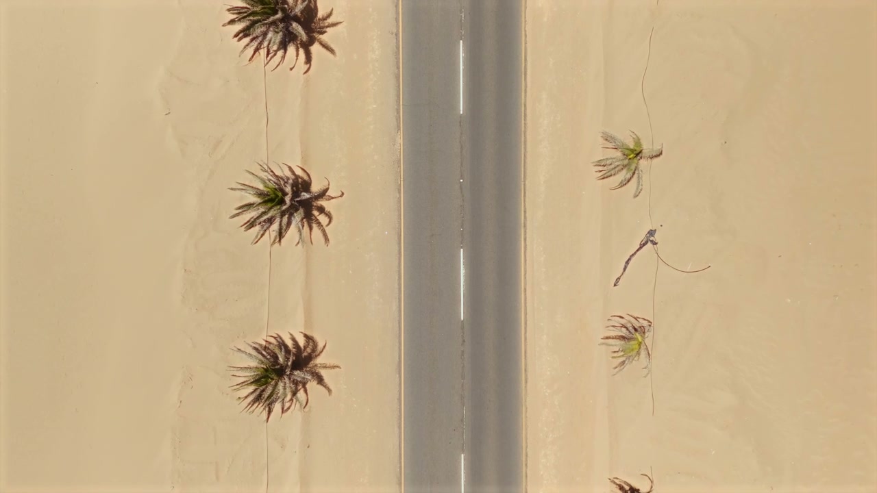 Cars Driving on Desert Road Overhead View